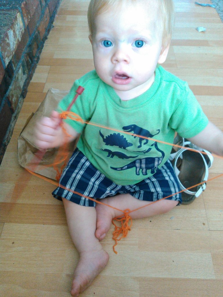 This is what Dragonfly was doing while everyone else was away for the day: "learning to knit." :)