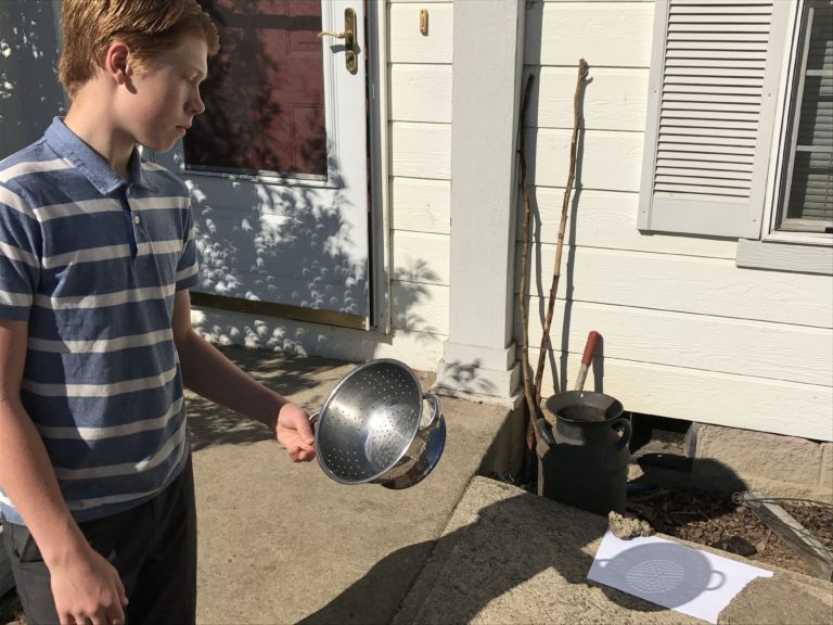 Seahawk aiming the colander at the paper.