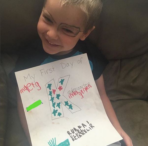 I told him he could decorate this sign any way he liked. He chose to fill the K with stars, and then he drew a fan near the bottom because "I like to make fans." He drew a picture of an envelope next to the fan because he "likes to mail things." Then he filled the rest of the area with random letters because he loves to write, even though he's not proficient enough to write anything but his name yet. Speaking of his name, he wrote that on his paper too, but I marked that out for privacy reasons. That's what the green box on the left is.