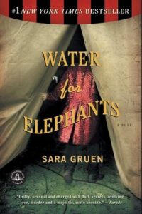 the official "water for elephants" book cover. a man is walking into a circus tent, and the title of the book is overlaid atop the image.